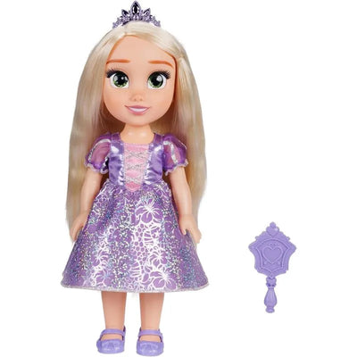 Rapunzel doll wearing a purple dress with sparkles and a crown, accompanied by a purple wand accessory.