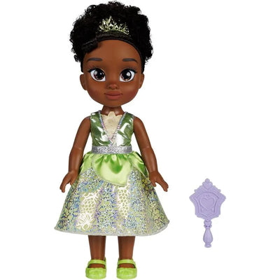 Large Tiana doll wearing a green dress with silver accents, accompanied by a purple accessory.