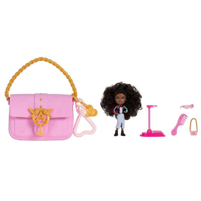 Aurora inspired doll with curly hair wearing a stylish outfit, next to a pink purse and accessories.