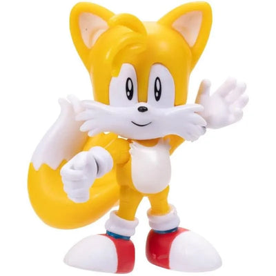 Tails action figure from Jakks, featuring yellow body, white belly, and signature red shoes, posed playfully.