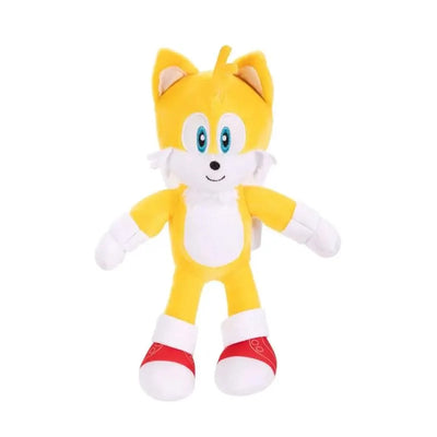 Plush toy of Tails from Sonic the Hedgehog, featuring yellow fur, blue eyes, and red shoes.