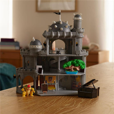 Deluxe Bowser Castle playset featuring multiple stories, detailed interior, and a Bowser figure.
