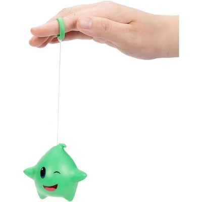 Green Luma yoyo from Jakks with a smiling star shape, held by a hand with a finger loop.