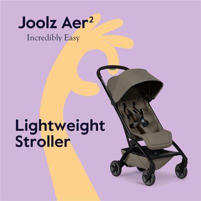 Joolz Aer² lightweight compact stroller in Hazel Brown, featuring a sleek design and comfortable seat, against a pastel purple background.