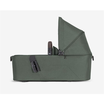 Joolz Aer2 Bassinet in Forest Green, featuring a collapsible canopy and a smooth fabric exterior, designed for infants.