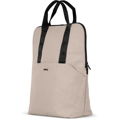 Changing backpack by Joolz in sandy taupe color, featuring black carrying straps and a front pocket.