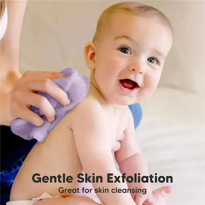Soft lilac baby wash cloth being used on a smiling baby’s back, emphasizing gentle skin exfoliation.