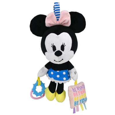 Minnie Mouse plush toy with a polka-dot skirt, attached teething ring, and fabric tag featuring positive affirmations.