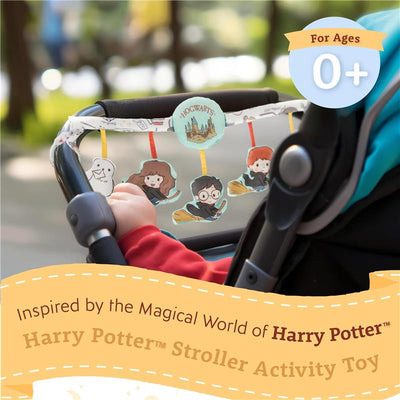 Deluxe Harry Potter Activity Soft Book hangs from a stroller, featuring colorful character images and a Hogwarts graphic.