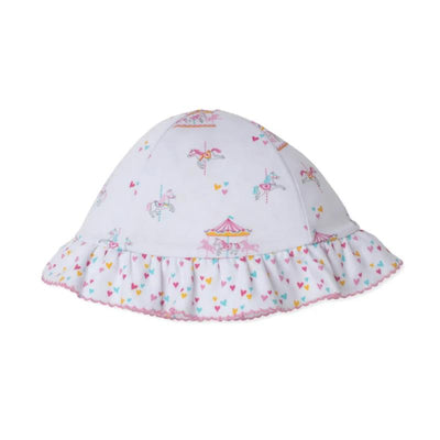 Reversible floppy hat featuring a carousel and hearts pattern, designed for children, with a ruffled trim.