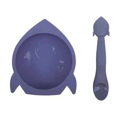 Blue silicone bowl shaped like a rocket, accompanied by a matching rocket-shaped spoon, designed for children.