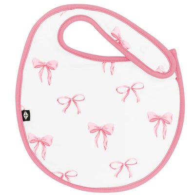 Cushy bib featuring pink bows on a white background, designed for babies. Trimmed in pink.