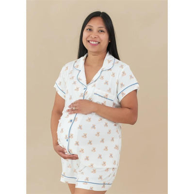 Kyte Baby Women’s Short Sleeve Pajama Set in Teddy Bear print, featuring a pregnant model smiling and holding her belly.
