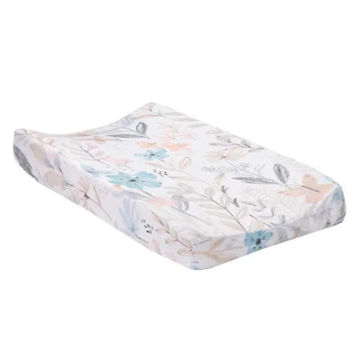Soft changing pad cover featuring a watercolor floral and butterfly design in pastel colors.