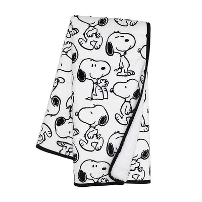 Lambs & Ivy Classic Snoopy Blanket features a white fabric with black Snoopy character patterns, ideal for cozying up.