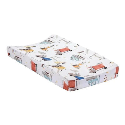 Changing pad cover featuring a construction zone theme with colorful trucks and construction elements.