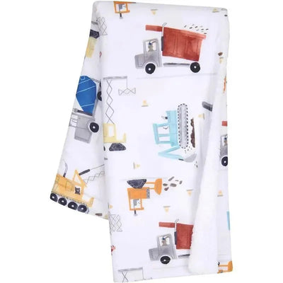 Cozy fleece baby blanket featuring colorful construction trucks and equipment on a white background.