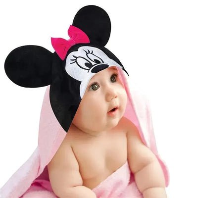 Hooded baby bath towel featuring Minnie Mouse design, pink towel draped around a surprised baby.