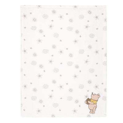 Ivory baby blanket featuring a pastel star and dot pattern, with a Winnie the Pooh illustration holding a jar.