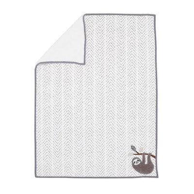 Soft baby blanket featuring a sloth hanging from a branch, with a chevron-patterned design in neutral colors.