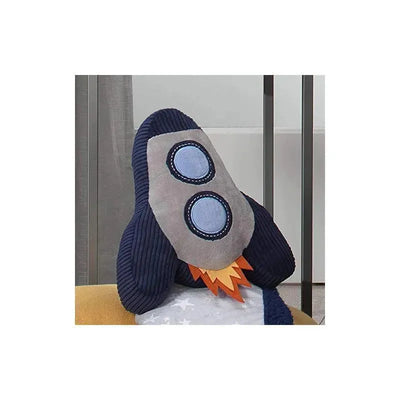 Plush rocket ship throw pillow in blue and grey with circular window details and orange flame accents, ideal for nursery decor.