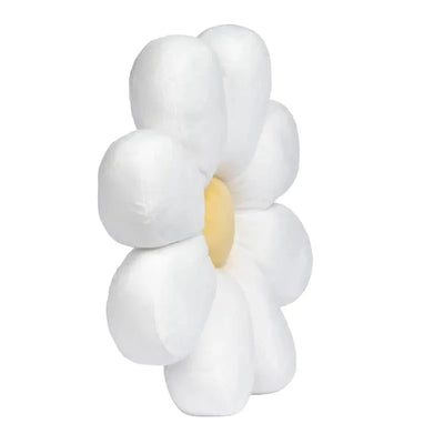 Plush white daisy-shaped pillow with a yellow center, designed for comfort and decorative use.