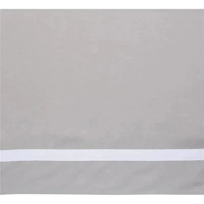 Gray linen crib skirt with white trim, designed to fit a four-sided crib, featuring a sleek and modern look.