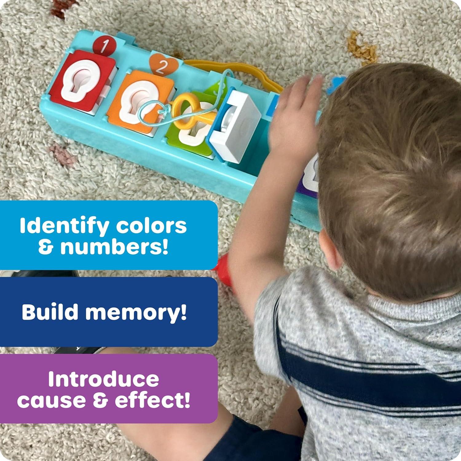 Child playing with Learning Resources Lock & Key Clubhouse toy featuring colorful locks and keys to teach colors and numbers.