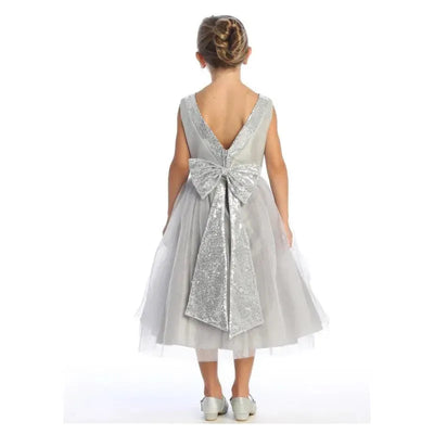 Silver baby girl dress with sequin V-back and large bow, made of shantung and tulle, featuring a layered skirt.