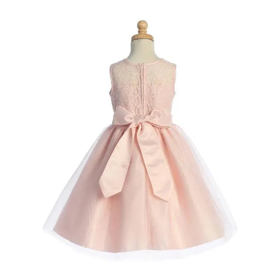 Lito baby girl dress in blush featuring lace bodice and a tulle skirt with a bow at the waist.