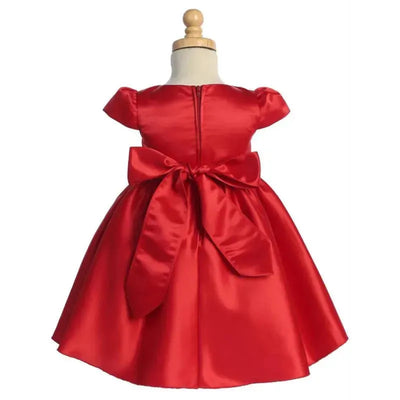 Satin baby girl dress in Christmas red with cap sleeves, a bow at the back, and bead & rhinestone trim. Size 12-18M.