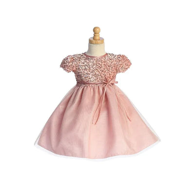 Light pink dress with short sequined sleeves, a tulle skirt, and a bow at the waist, designed for girls.