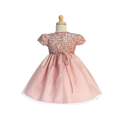 Light pink velvet dress with sequins and glitter tulle, featuring puff sleeves and a bow at the back.