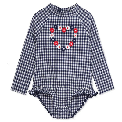 Long-sleeve blue gingham rashguard swimsuit for baby girls, featuring a floral heart design and ruffled hem.