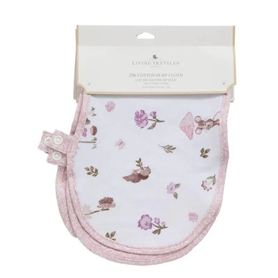 Two-pack of cotton burp cloths featuring a mushroom house design and floral patterns, with pink trim and snap buttons.