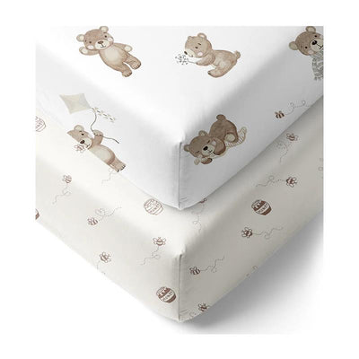 Cotton jersey fitted sheets featuring playful bear designs on a white and light gray background.