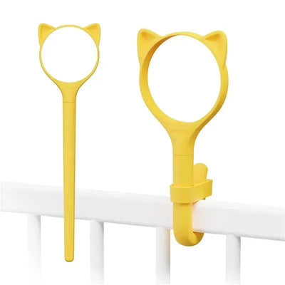 Yellow lollipop-shaped exchangeable outer sleeve with cat ears, designed to fit securely on a railing.