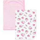 Interlock cotton swaddle blankets featuring a pink polka dot design and a floral pattern with pink roses.