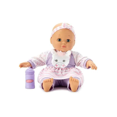 Madame Alexander Baby Cuddles doll wearing a purple outfit with a unicorn bib, holding a purple bottle.