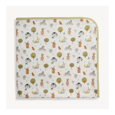 Organic cotton blanket featuring a whimsical farm animal pattern, with cows, horses, trees, and houses.
