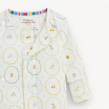 Cream modal convertible coverall with colorful nursery-themed prints, featuring toys, animals, and pastel colors.
