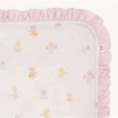Pink baby blanket with a soft ruffled edge, featuring playful animal illustrations playing instruments.