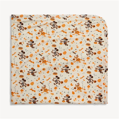Spooky Season Modal Blanket featuring playful Halloween-themed prints of skeletons, pumpkins, and festive designs.