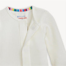 White waffle-knit footie from Magnetic Me, featuring a colorful striped neckline and snap closure.