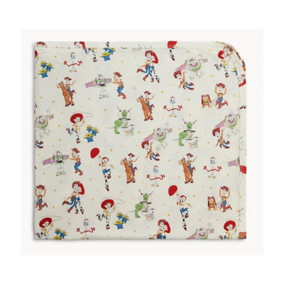 Modal blanket featuring colorful characters from Toy Story, including Woody, Buzz Lightyear, and Jessie, on a light background.