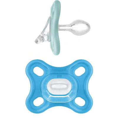 Two pacifiers designed for boys, one light blue with a transparent nipple and one blue with a button in the center.