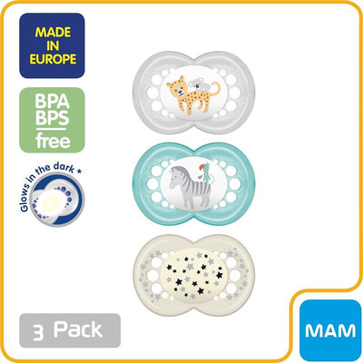 Three MAM baby pacifiers in a pack, featuring a leopard and koala, a zebra, and a design with silver stars. Glows in the dark and BPA/BPS free.