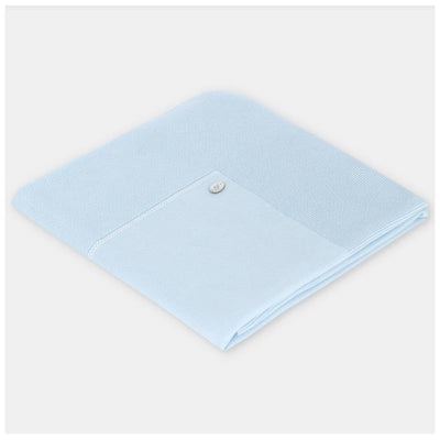 Knit baby blanket by Martin Aranda in pastel blue, featuring a subtle textured design and a small decorative button.