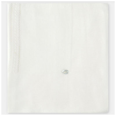 White knit baby blanket featuring a textured design and a decorative button on one corner.