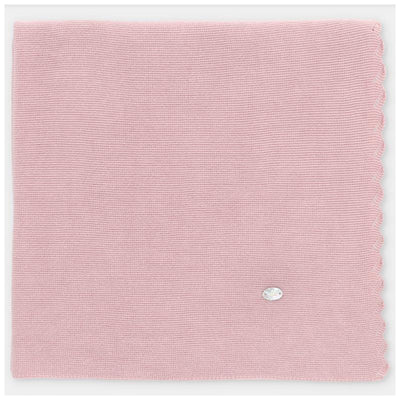 Light pink knit baby blanket with scalloped edges and a small decorative tag. Ideal for infants.